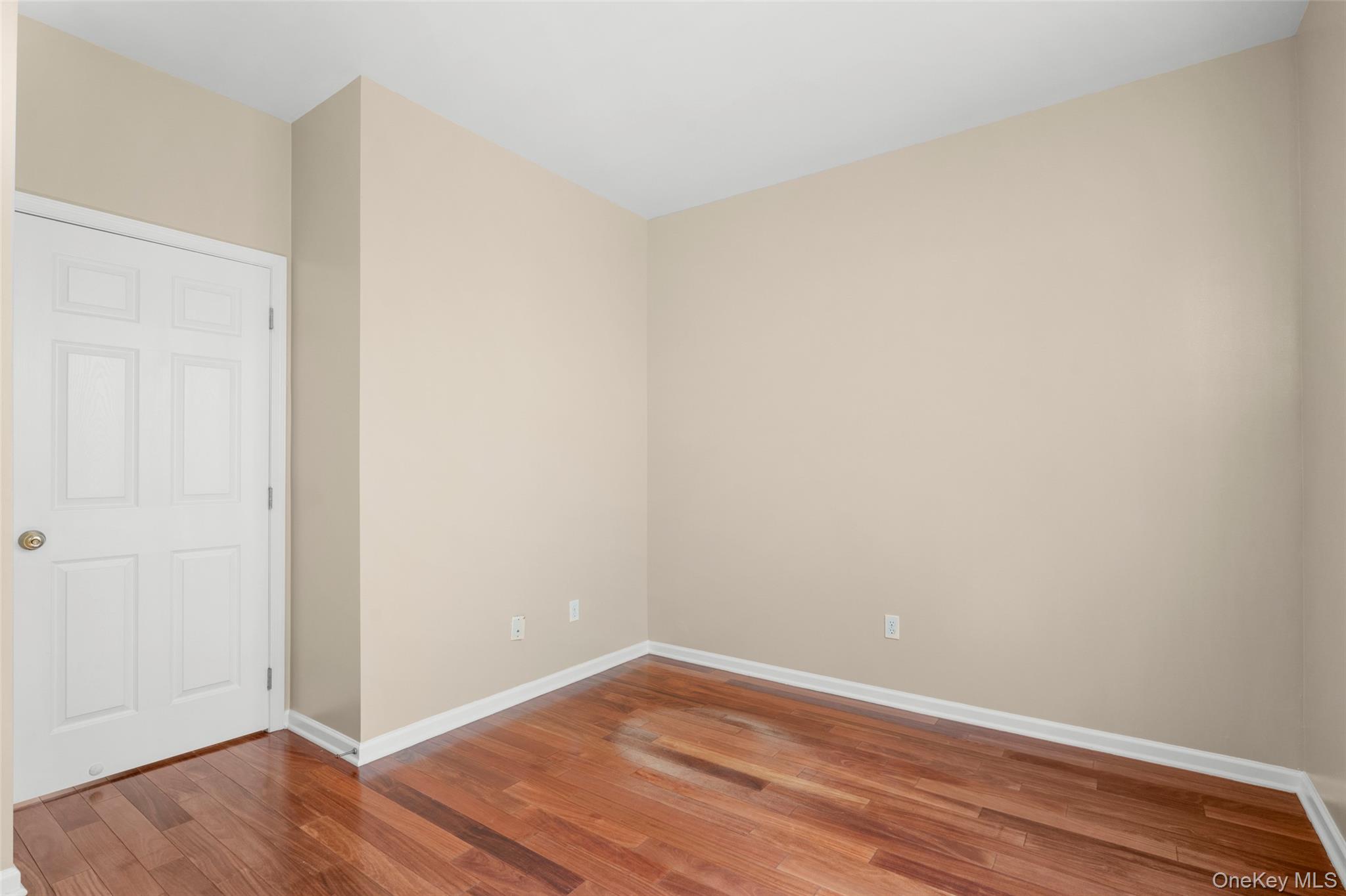 411 Vassar Place Fishkill, NY 12524 - Photo 17 of 39 a view of an empty room with wooden floor