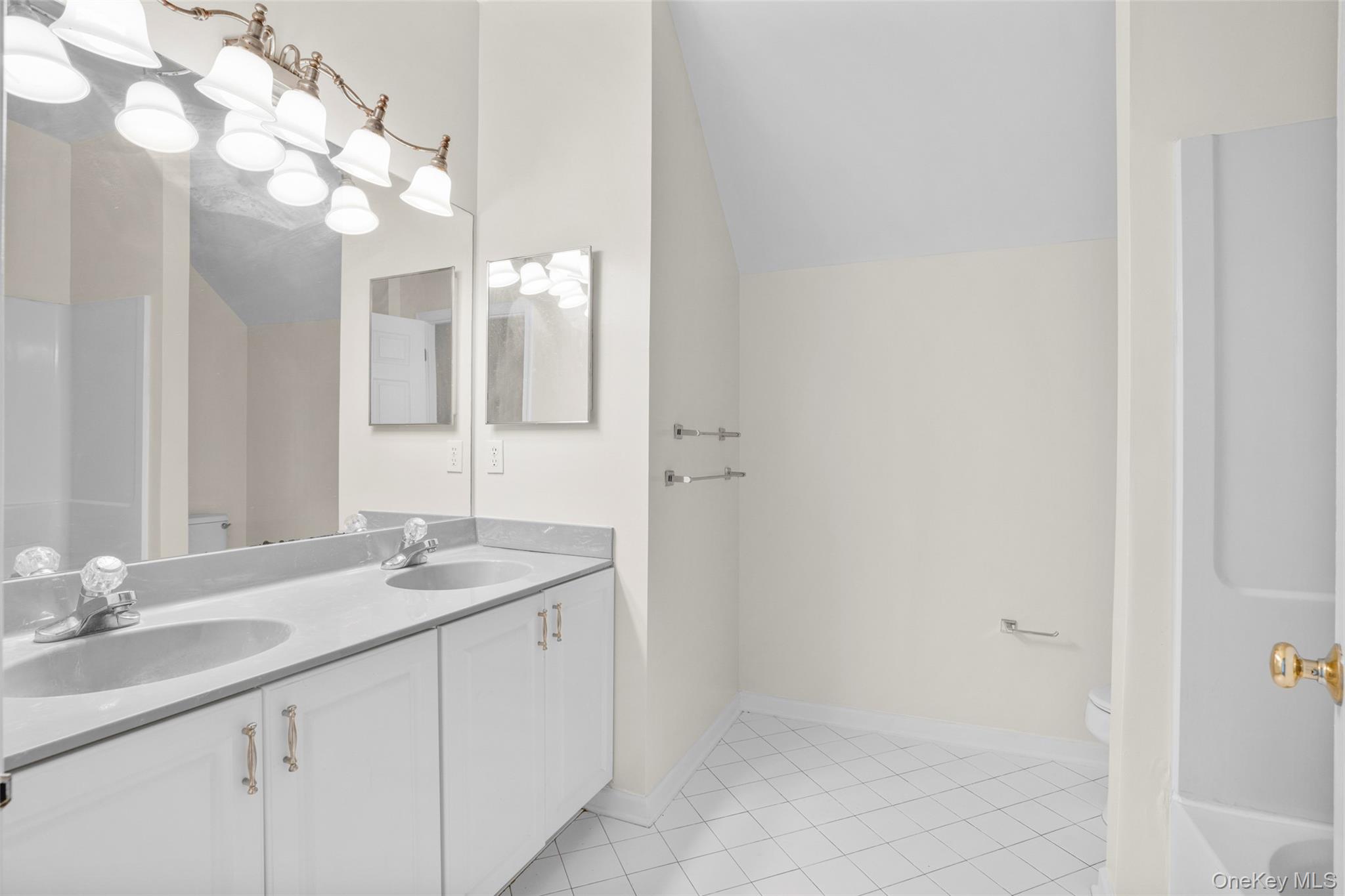 411 Vassar Place Fishkill, NY 12524 - Photo 28 of 39 a bathroom with a sink vanity and a mirror