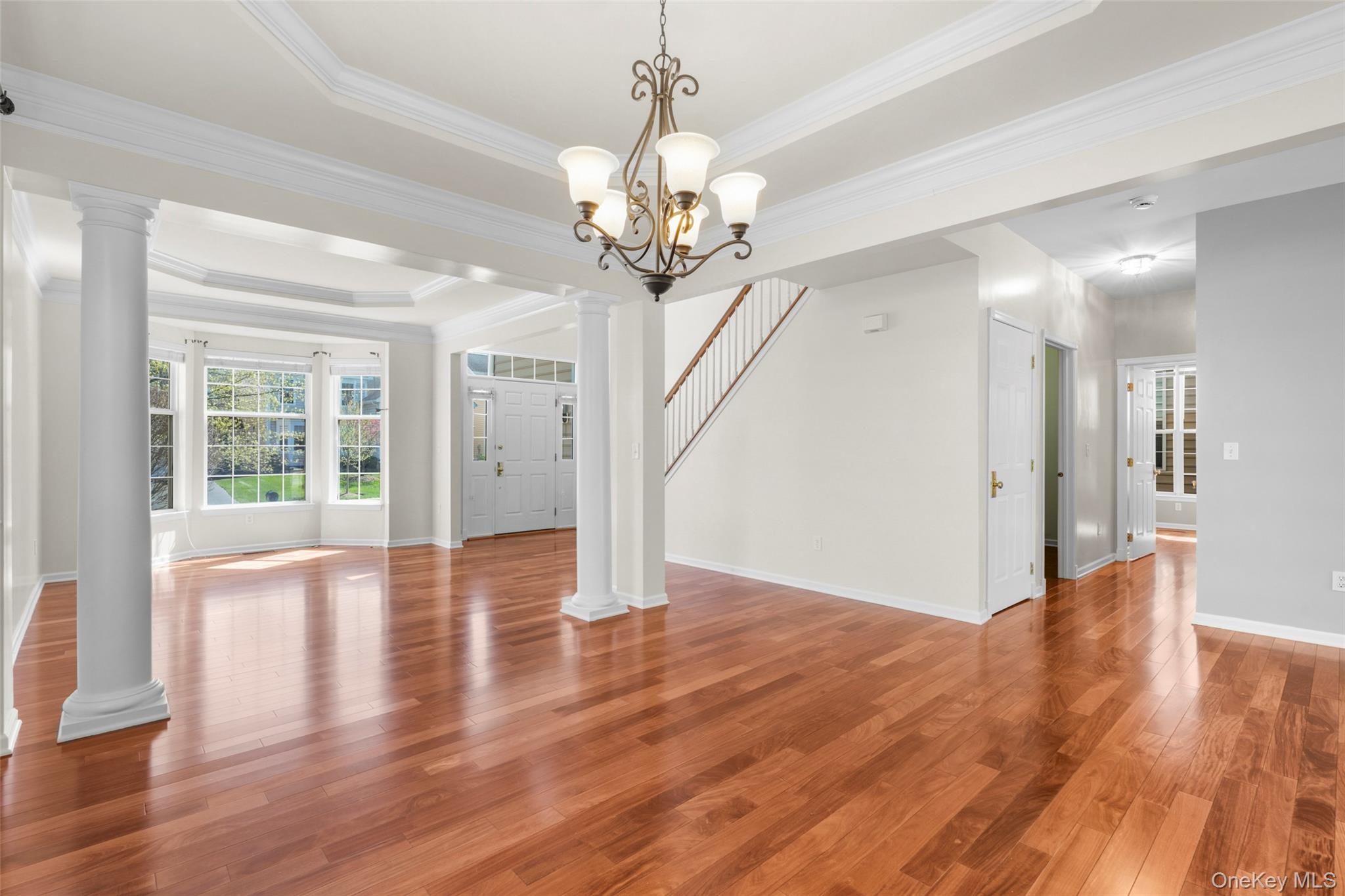 411 Vassar Place Fishkill, NY 12524 - Photo 9 of 39 a view of an empty room with wooden floor and a large window