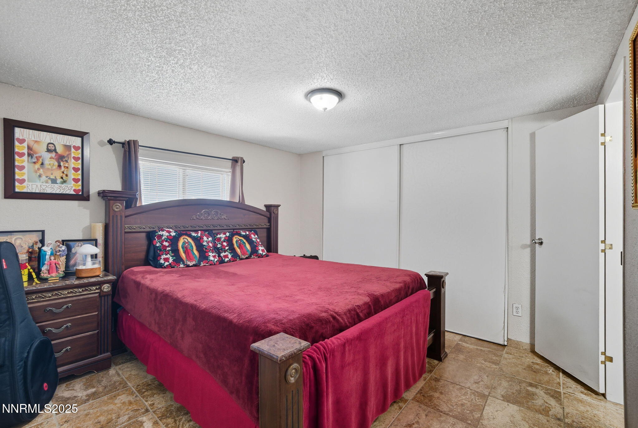 2135 Barberry Way Reno, NV 89512 - Photo 11 of 16 a bedroom with a bed and a closet