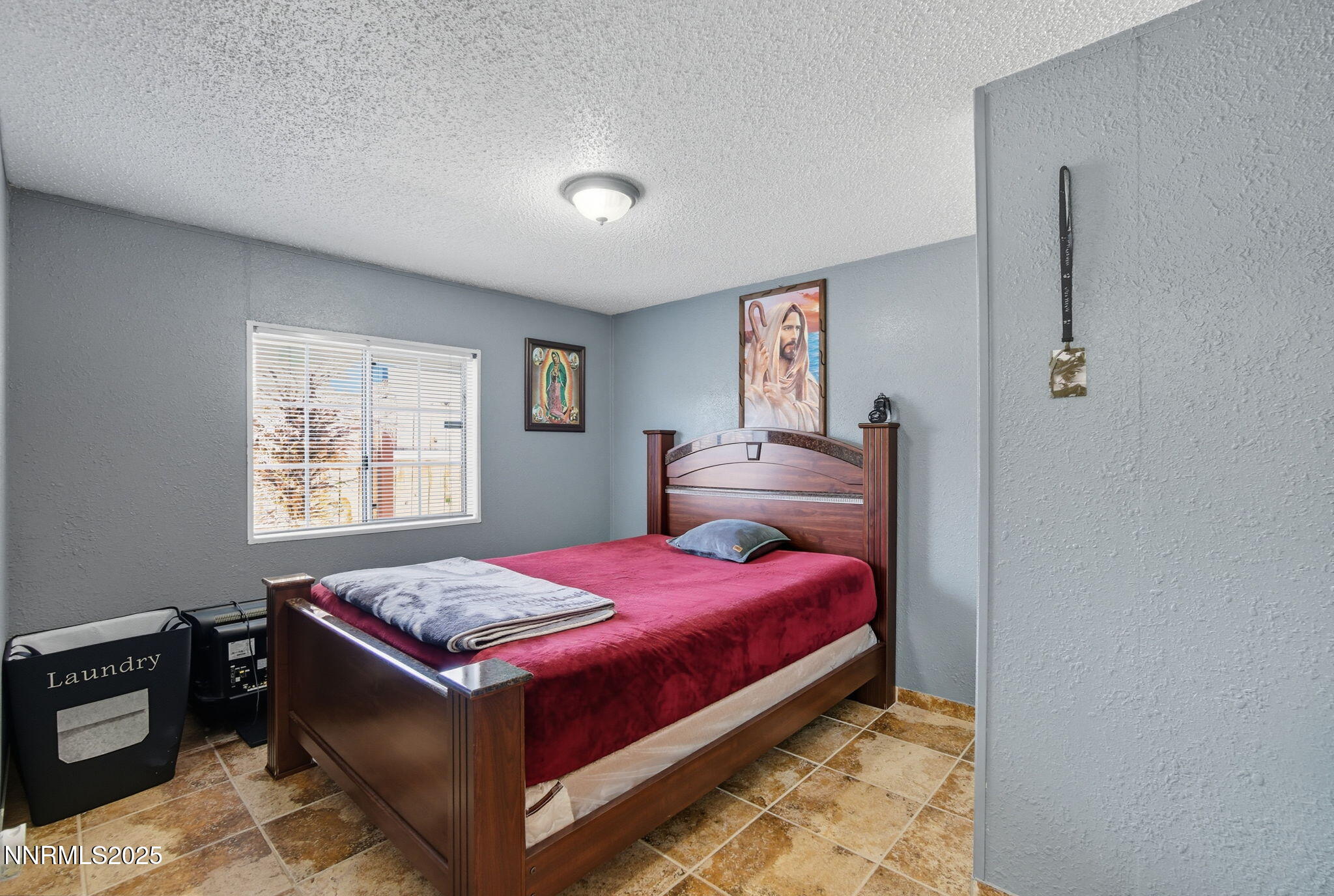 2135 Barberry Way Reno, NV 89512 - Photo 12 of 16 a bed room with a bed and a tv