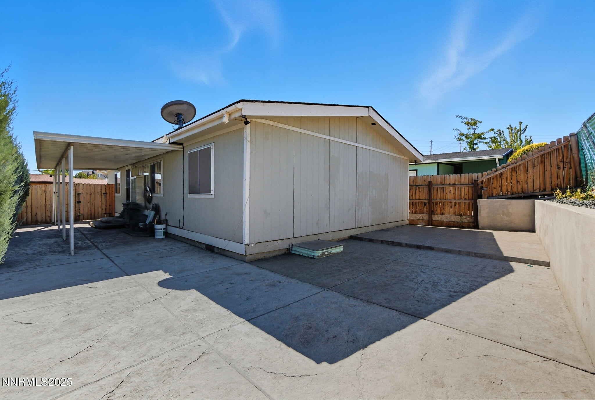 2135 Barberry Way Reno, NV 89512 - Photo 14 of 16 a backyard of a house with table and sofas