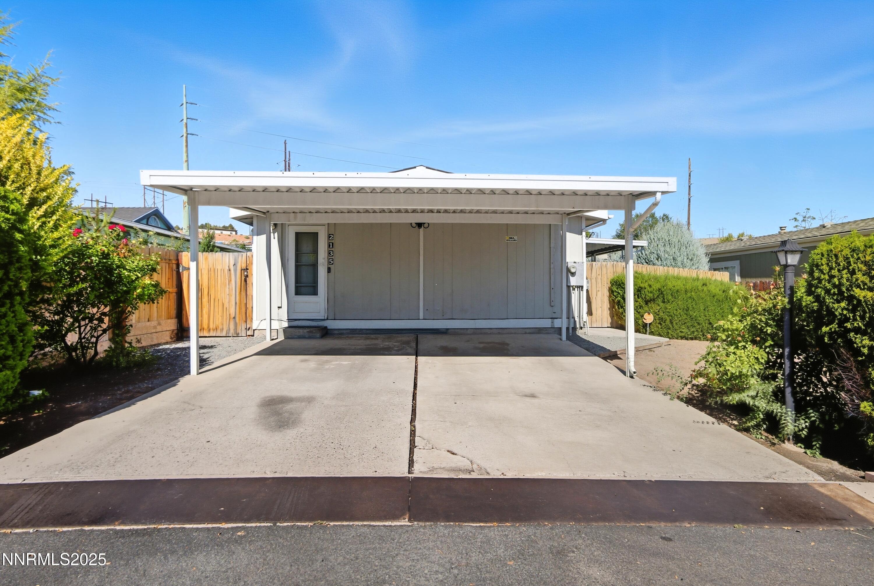 2135 Barberry Way Reno, NV 89512 - Photo 2 of 16 a view of a house with garage