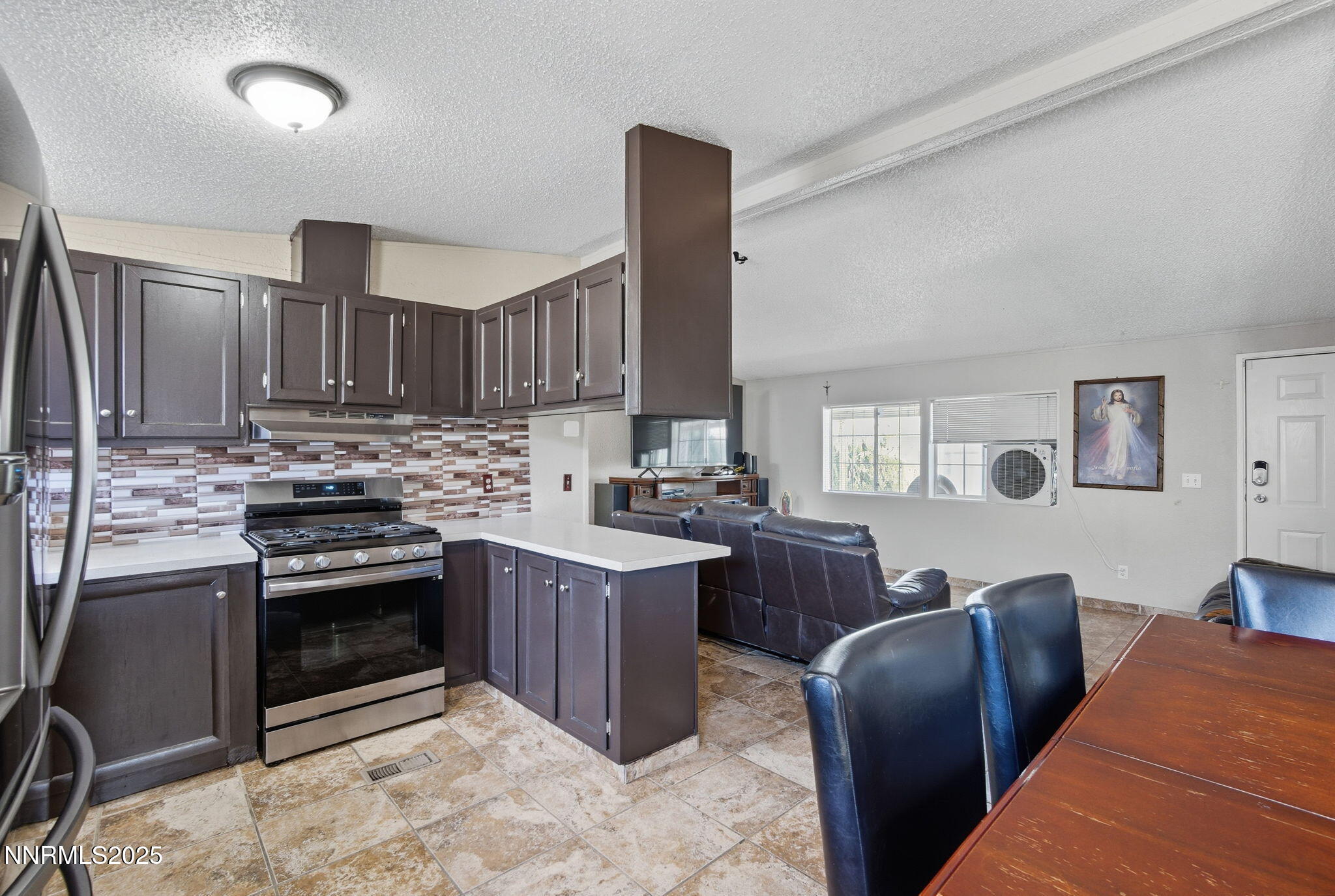 2135 Barberry Way Reno, NV 89512 - Photo 8 of 16 a kitchen with stainless steel appliances granite countertop a stove sink and cabinets