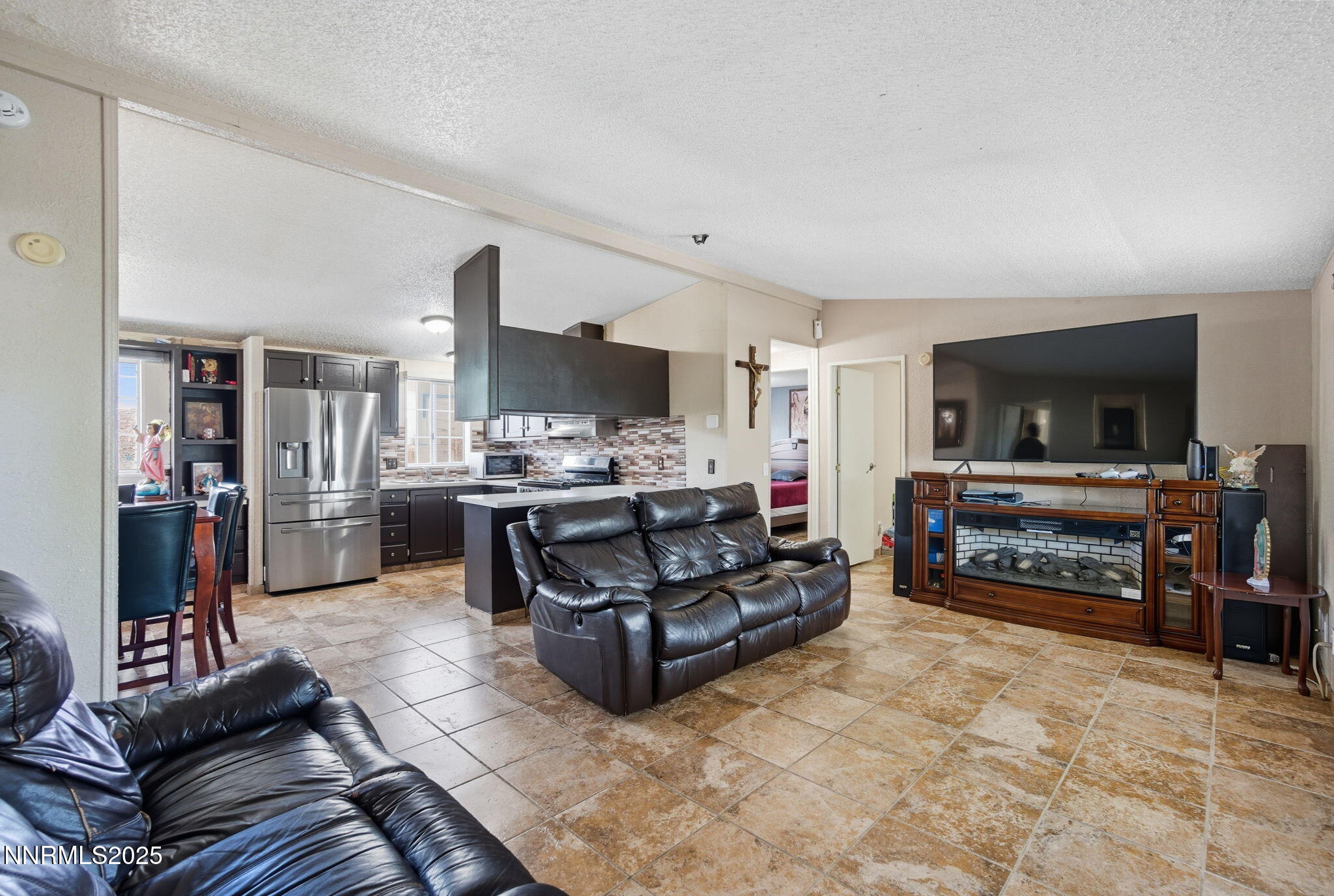 2135 Barberry Way Reno, NV 89512 - Photo 9 of 16 a living room with furniture and a flat screen tv