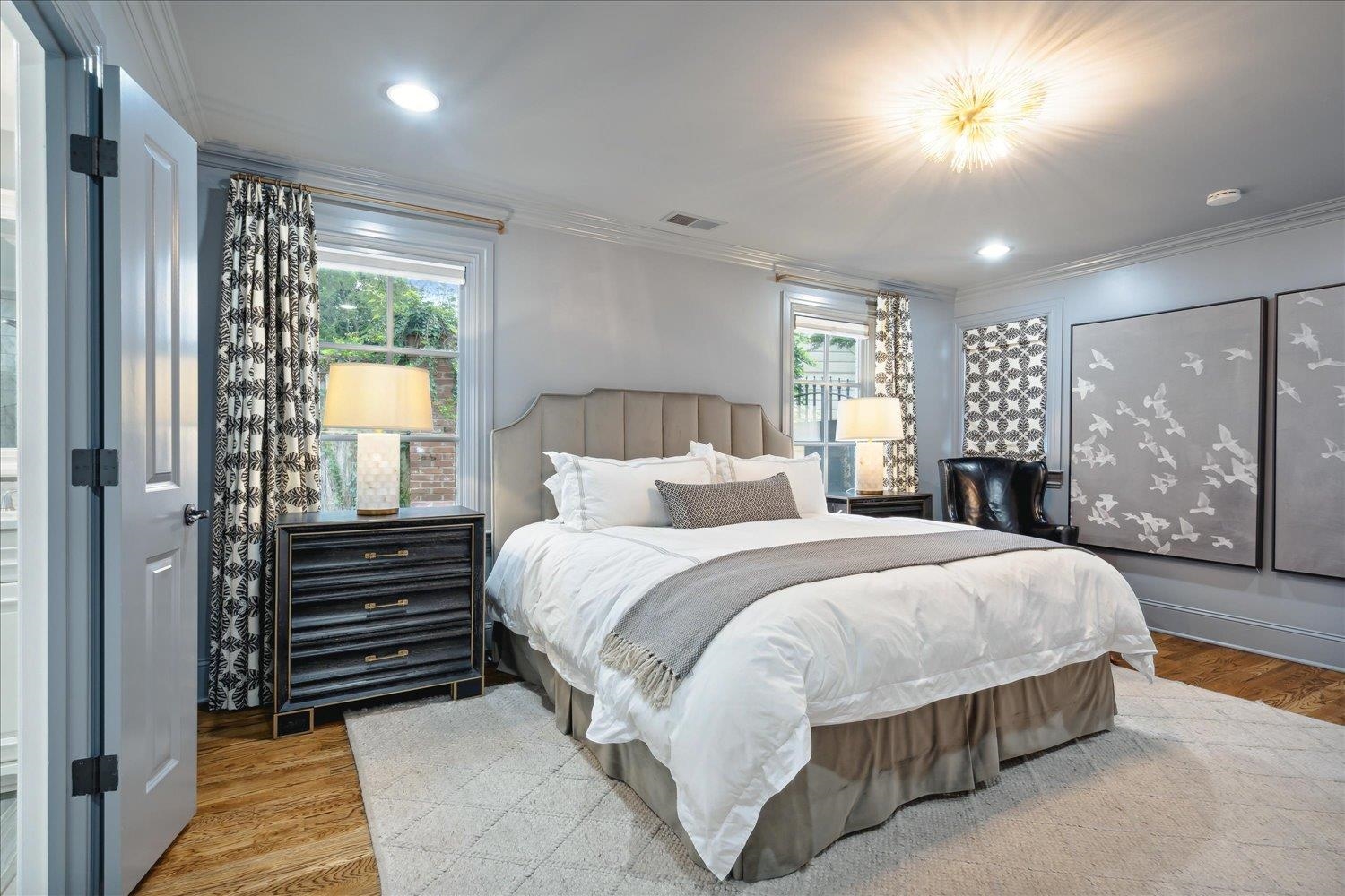 279 Ridgefield Road Memphis, TN 38111 - Photo 11 of 23 a spacious bedroom with a bed and a chandelier