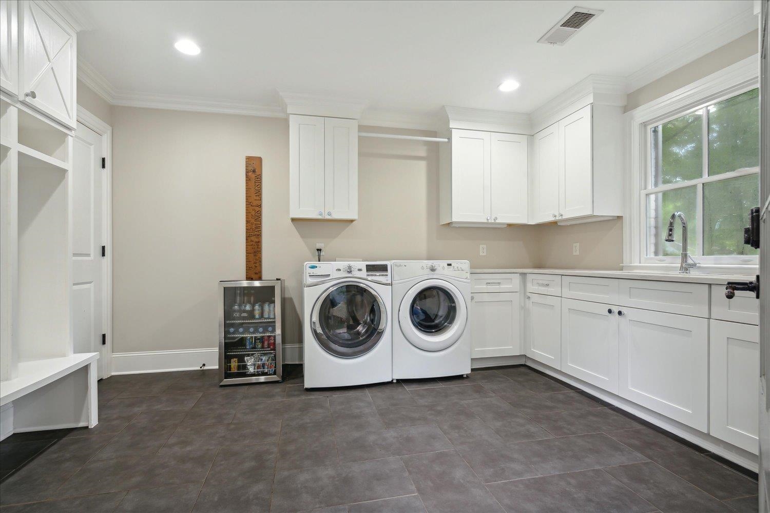 279 Ridgefield Road Memphis, TN 38111 - Photo 19 of 23 a utility room with sink dryer and washer