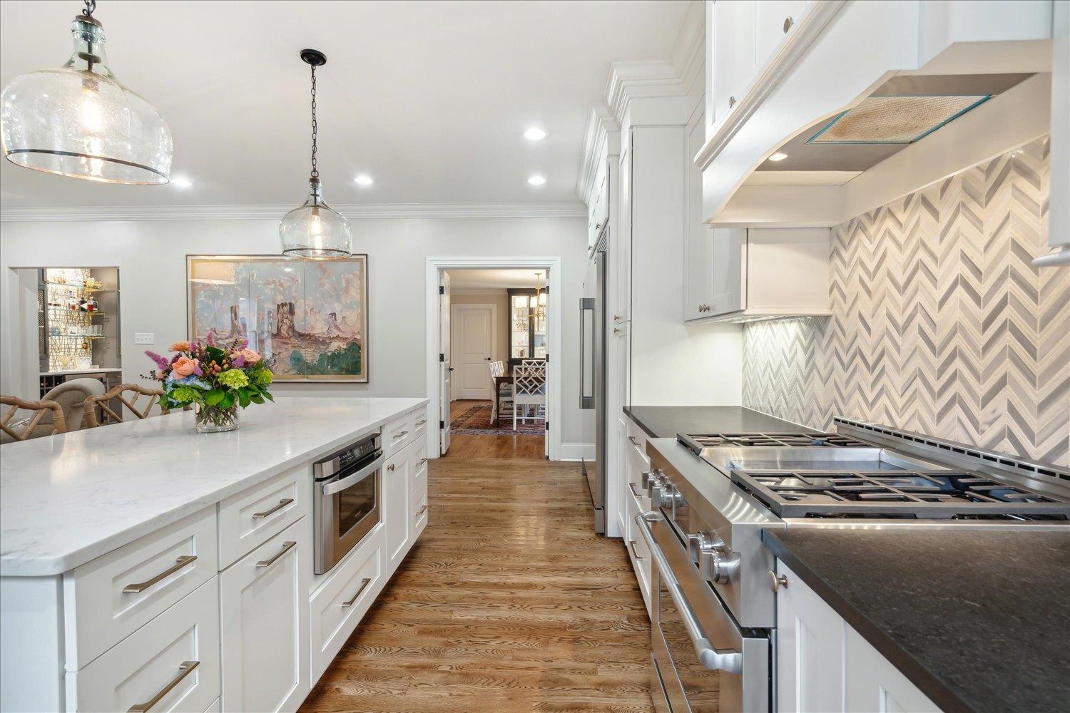279 Ridgefield Road Memphis, TN 38111 - Photo 7 of 23 a kitchen with kitchen island granite countertop a sink a counter space and cabinets