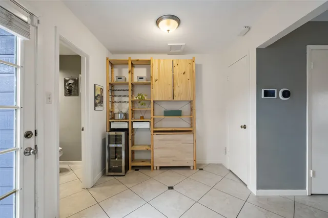 front view of a brick house with a small yard