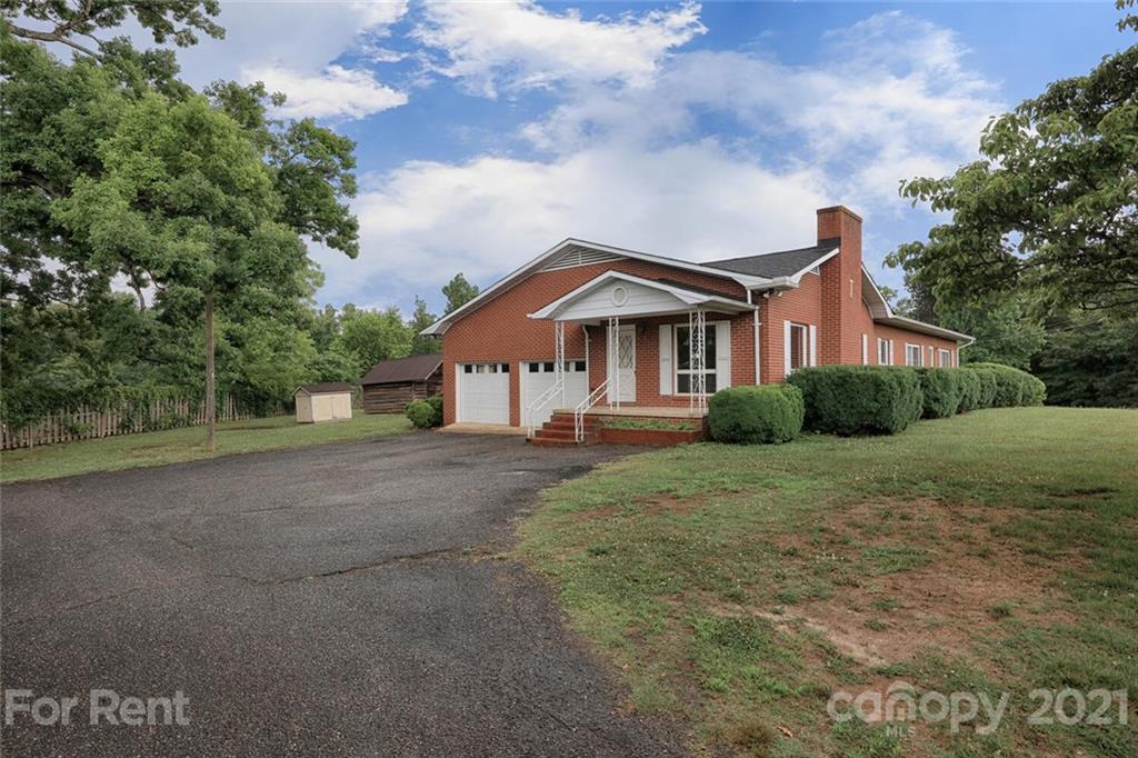 190 Turbyfill Road Mooresville, NC 28117 - Photo 2 of 28 a front view of a house with a yard and garage