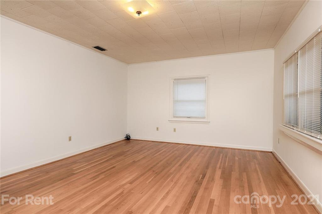 190 Turbyfill Road Mooresville, NC 28117 - Photo 12 of 28 an empty room with wooden floor and windows