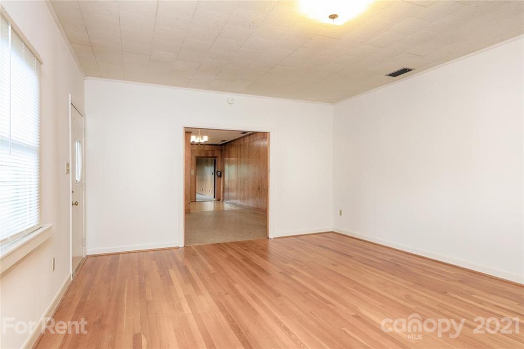 190 Turbyfill Road Mooresville, NC 28117 - Photo 13 of 28 a view of empty room with wooden floor and fan