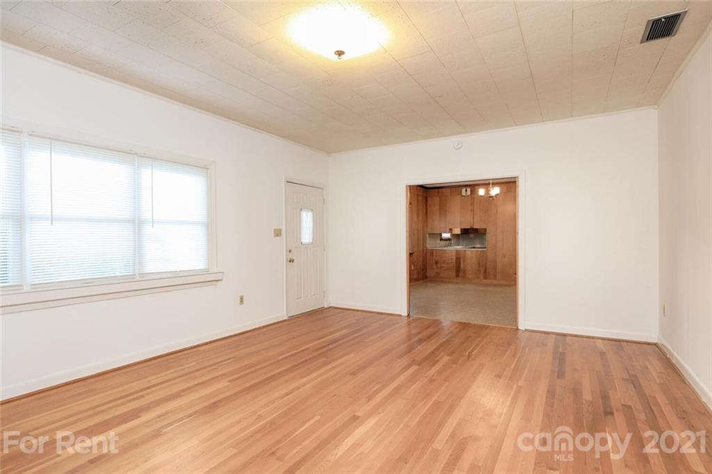 190 Turbyfill Road Mooresville, NC 28117 - Photo 14 of 28 an empty room with wooden floor and windows