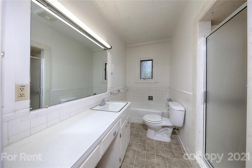 190 Turbyfill Road Mooresville, NC 28117 - Photo 18 of 28 a bathroom with a granite countertop toilet sink and mirror