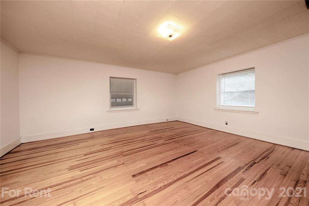 190 Turbyfill Road Mooresville, NC 28117 - Photo 19 of 28 a view of empty room with wooden floor and fan