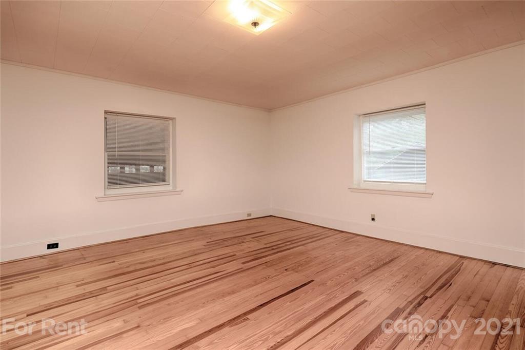 190 Turbyfill Road Mooresville, NC 28117 - Photo 20 of 28 a view of an empty room with wooden floor and a window