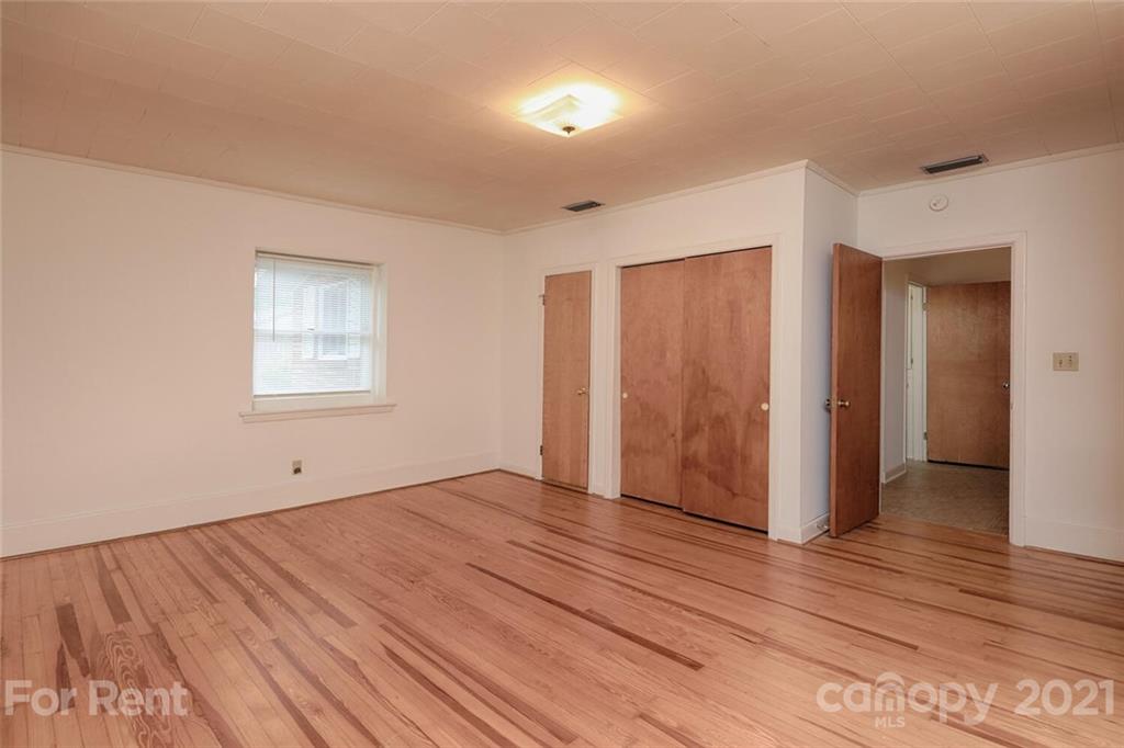 190 Turbyfill Road Mooresville, NC 28117 - Photo 21 of 28 an empty room with wooden floor and windows