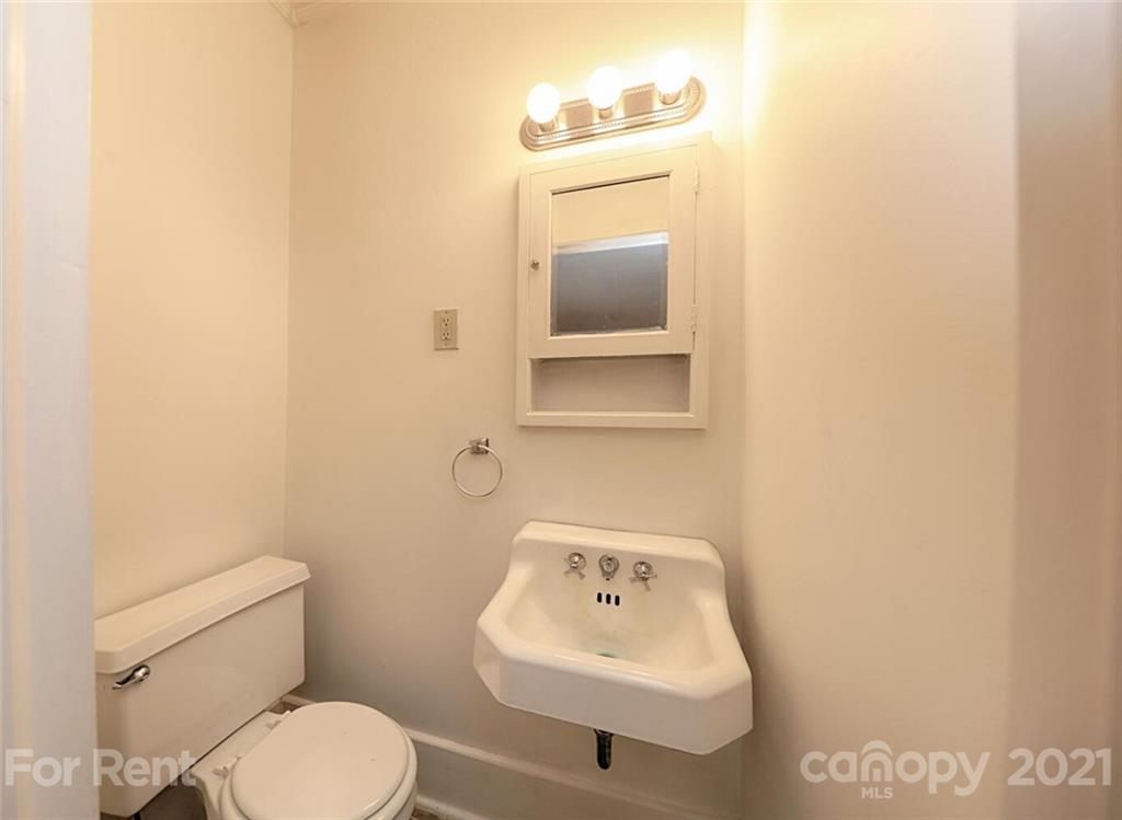 190 Turbyfill Road Mooresville, NC 28117 - Photo 23 of 28 a bathroom with a toilet sink and mirror