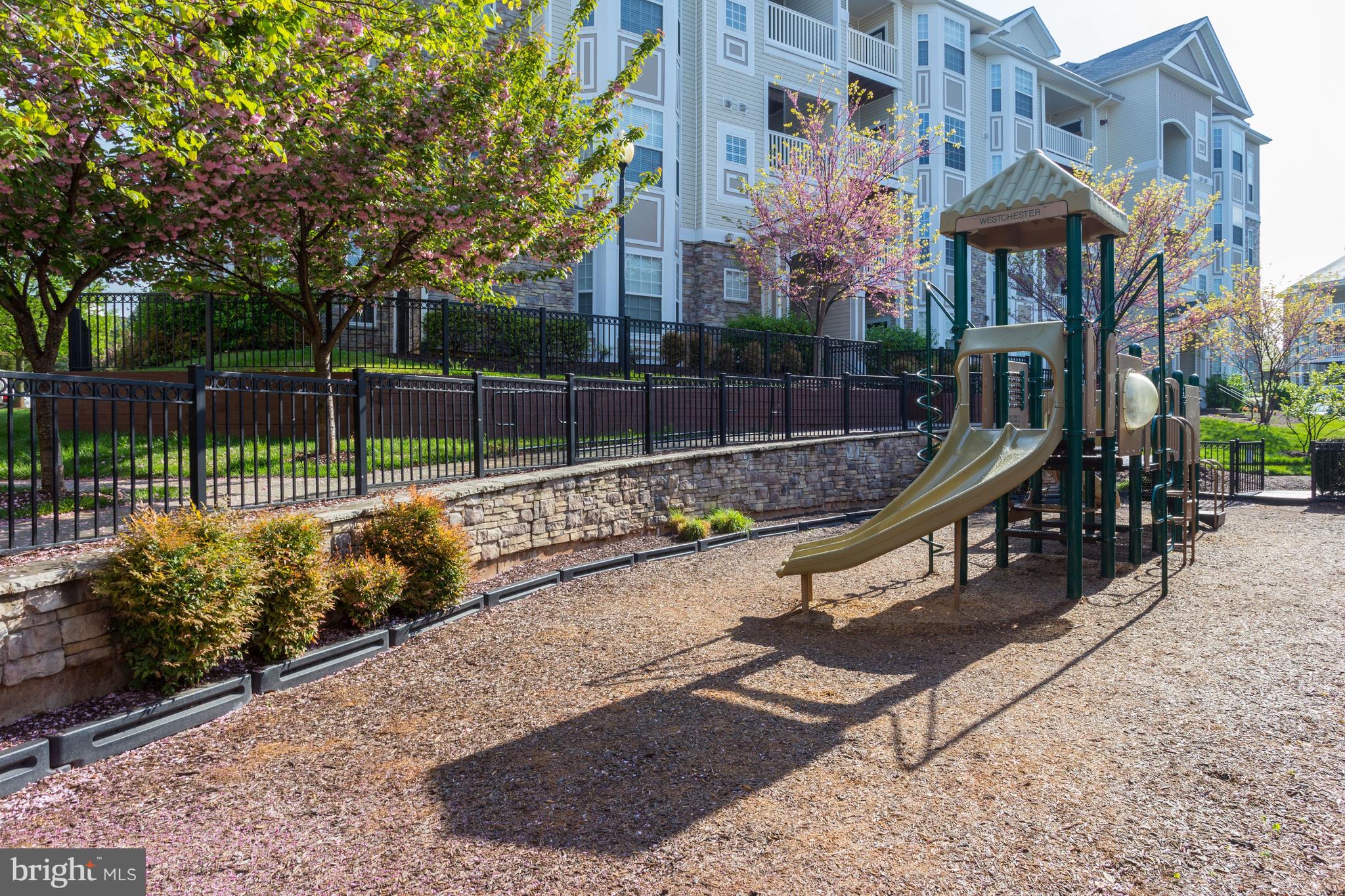 503 Sunset View Terrace Southeast, Unit 407 Leesburg, VA 20175 - Photo 26 of 35 a view of a park with iron fence