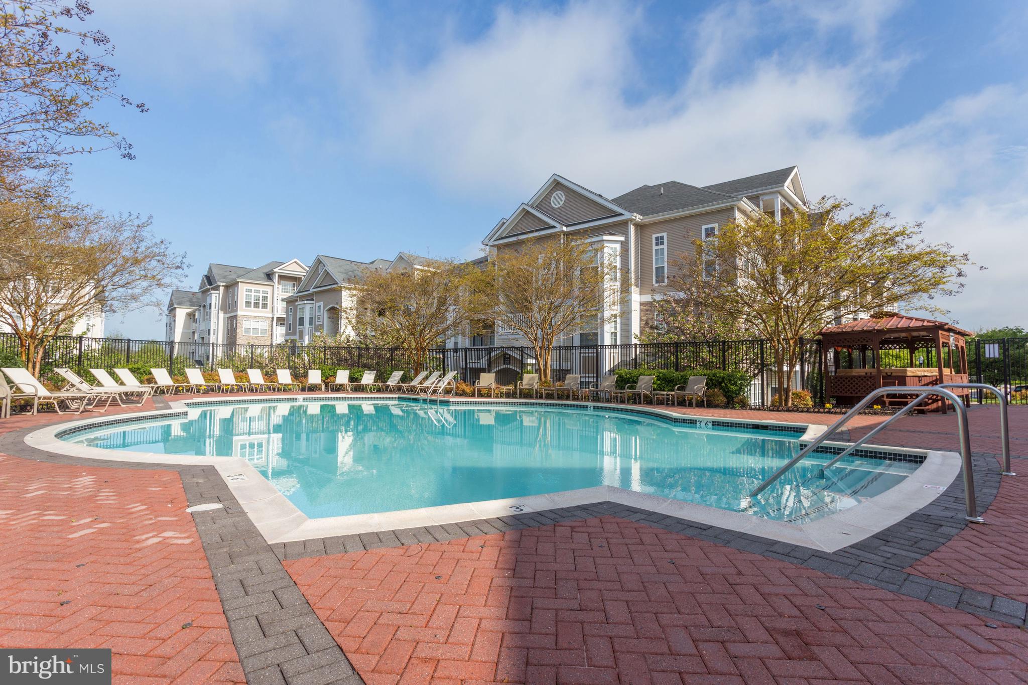 503 Sunset View Terrace Southeast, Unit 407 Leesburg, VA 20175 - Photo 30 of 35 a view of a lake in front of the house