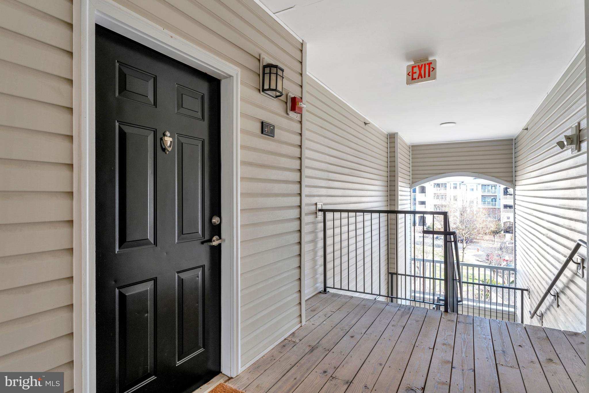503 Sunset View Terrace Southeast, Unit 407 Leesburg, VA 20175 - Photo 4 of 35 a view of a balcony with wooden floor