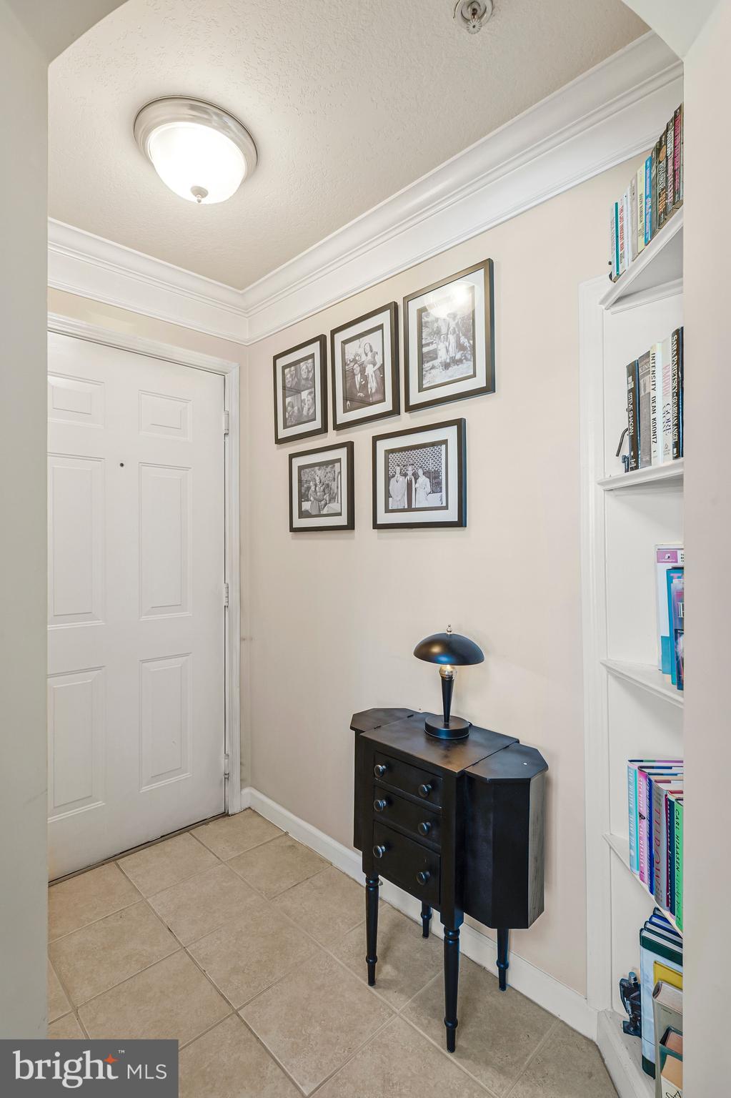 503 Sunset View Terrace Southeast, Unit 407 Leesburg, VA 20175 - Photo 5 of 35 a bedroom with furniture and a book shelf