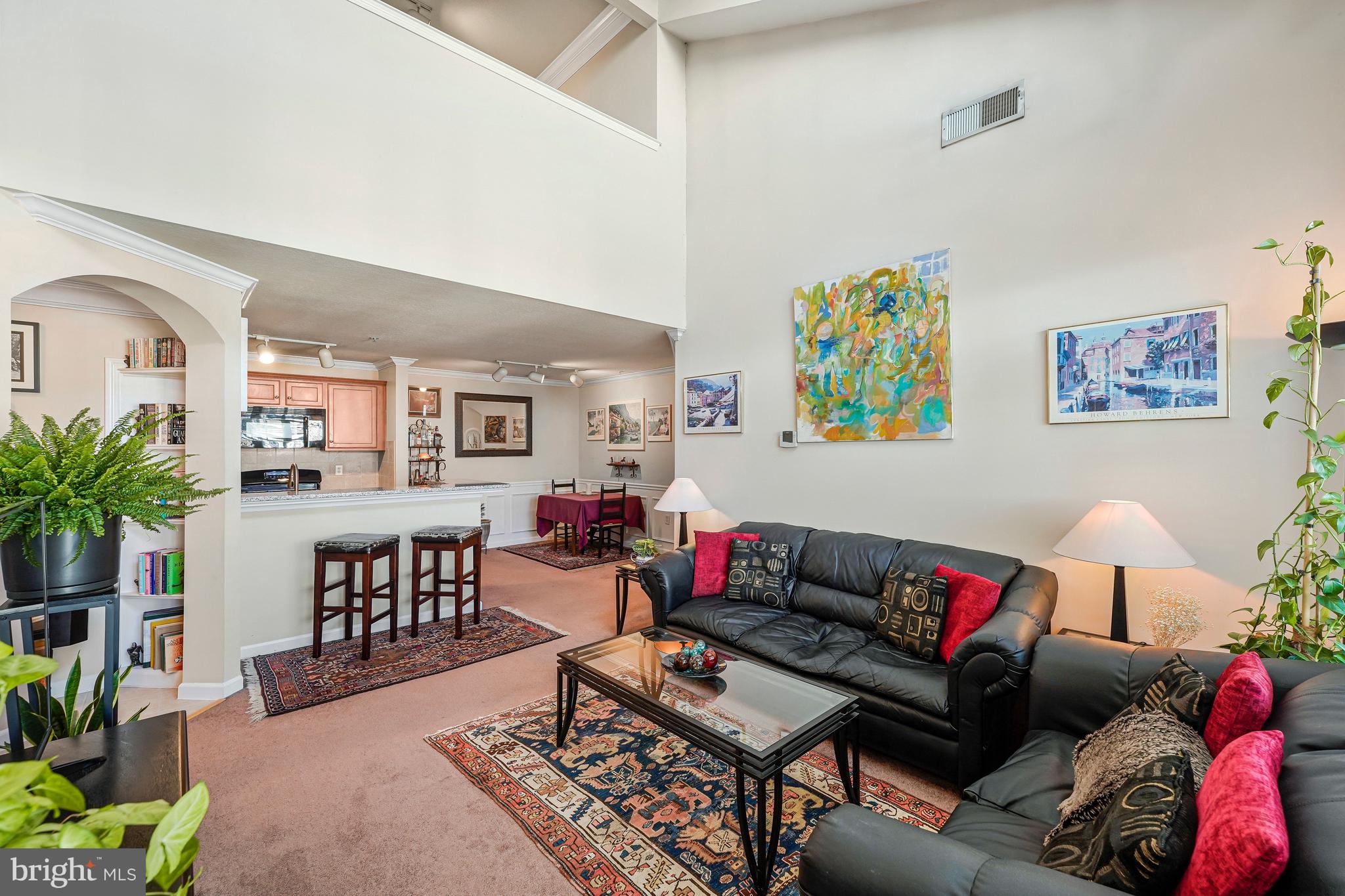 503 Sunset View Terrace Southeast, Unit 407 Leesburg, VA 20175 - Photo 8 of 35 a living room with furniture and wooden floor