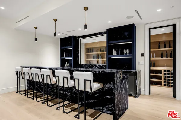 a view of a chairs and table in a room