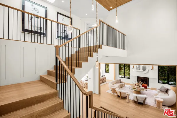 a view of entryway livingroom and hall with wooden floor