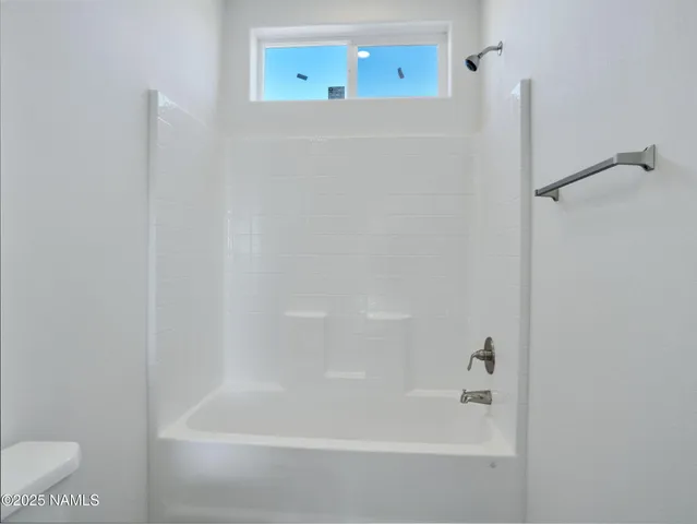 a bathroom with a sink toilet and bathtub
