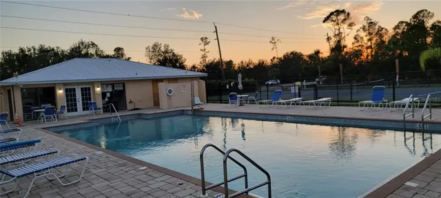 a view of a swimming pool with a patio