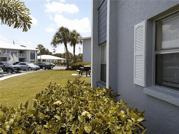 a couple of cars parked in front of a house