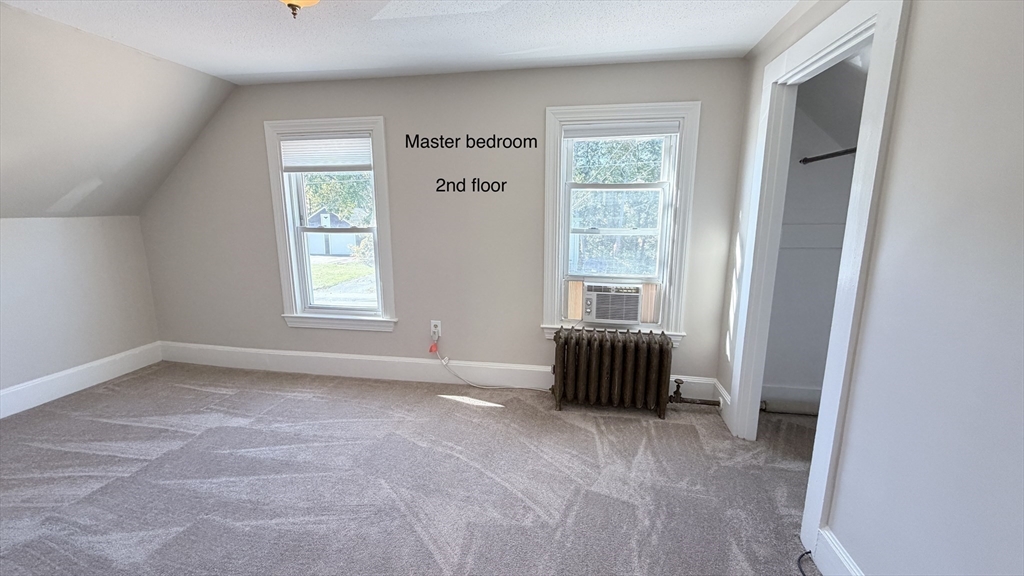 391 Commercial Street Braintree, MA 02184 - Photo 13 of 21 a view of an empty room with a window