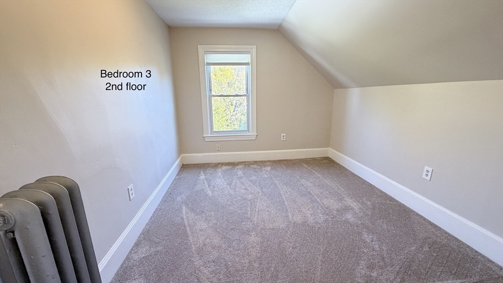 391 Commercial Street Braintree, MA 02184 - Photo 16 of 21 a view of an empty room with a window