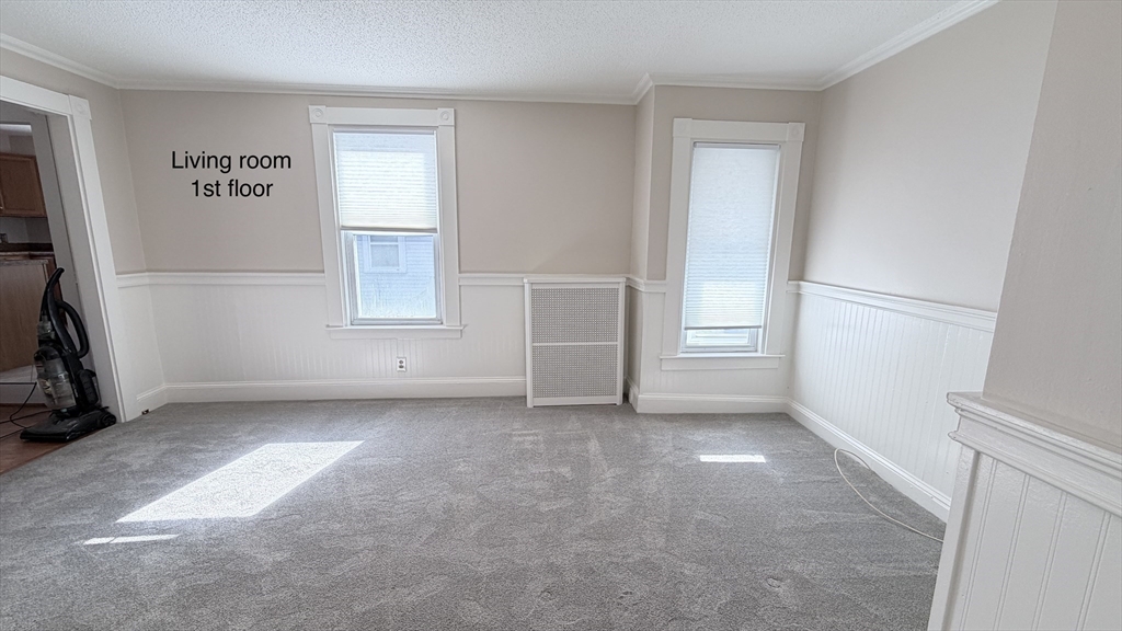 391 Commercial Street Braintree, MA 02184 - Photo 6 of 21 an empty room with windows