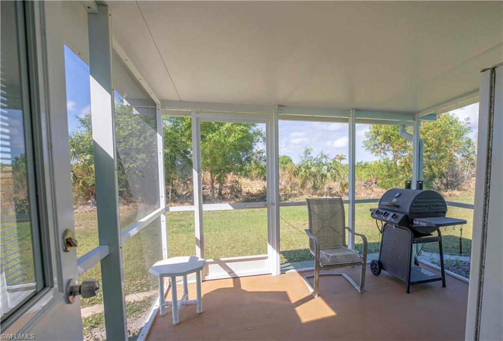 1900 Platt Road Naples, FL 34120 - Photo 16 of 35 Side Porch off Laundry Room
