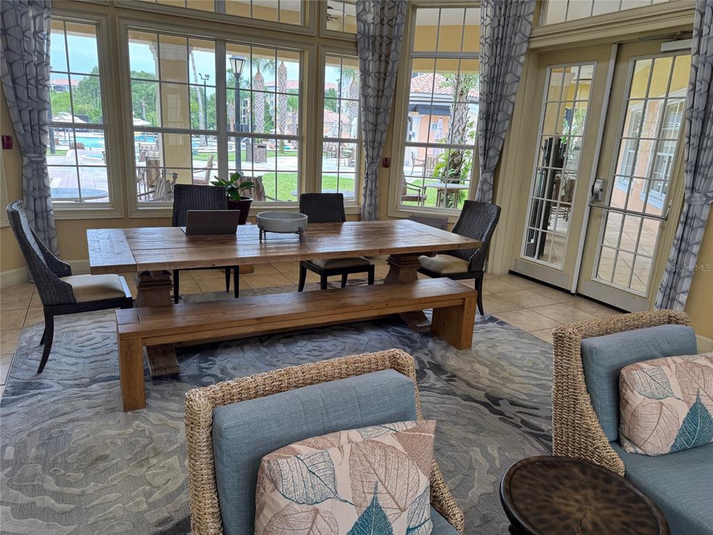 8762 Worldquest Boulevard, Unit 6203 Orlando, FL 32821 - Photo 30 of 31 a living room with furniture and a floor to ceiling window