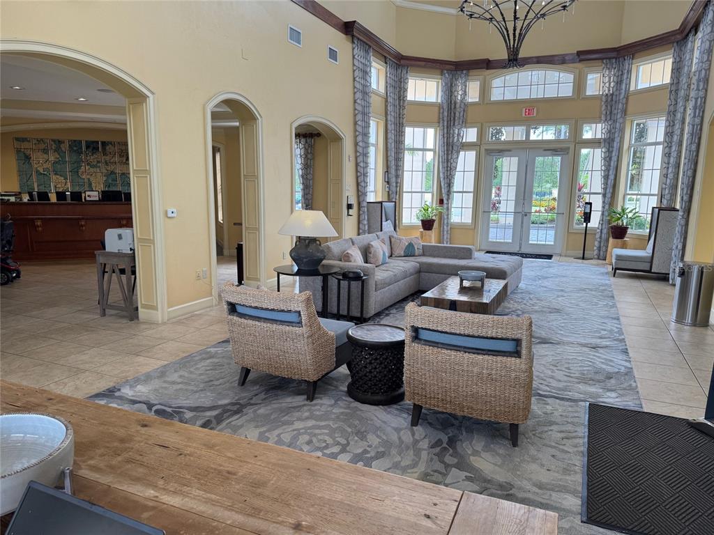 8762 Worldquest Boulevard, Unit 6203 Orlando, FL 32821 - Photo 31 of 31 a living room with furniture and large windows