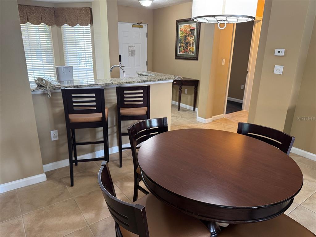 8762 Worldquest Boulevard, Unit 6203 Orlando, FL 32821 - Photo 6 of 31 a view of a livingroom with furniture and bathroom