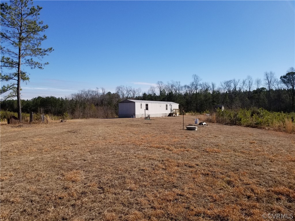 16991 Fox Branch Road Carson, VA 23830 - Photo 5 of 17 a view of a dry yard with wooden fence