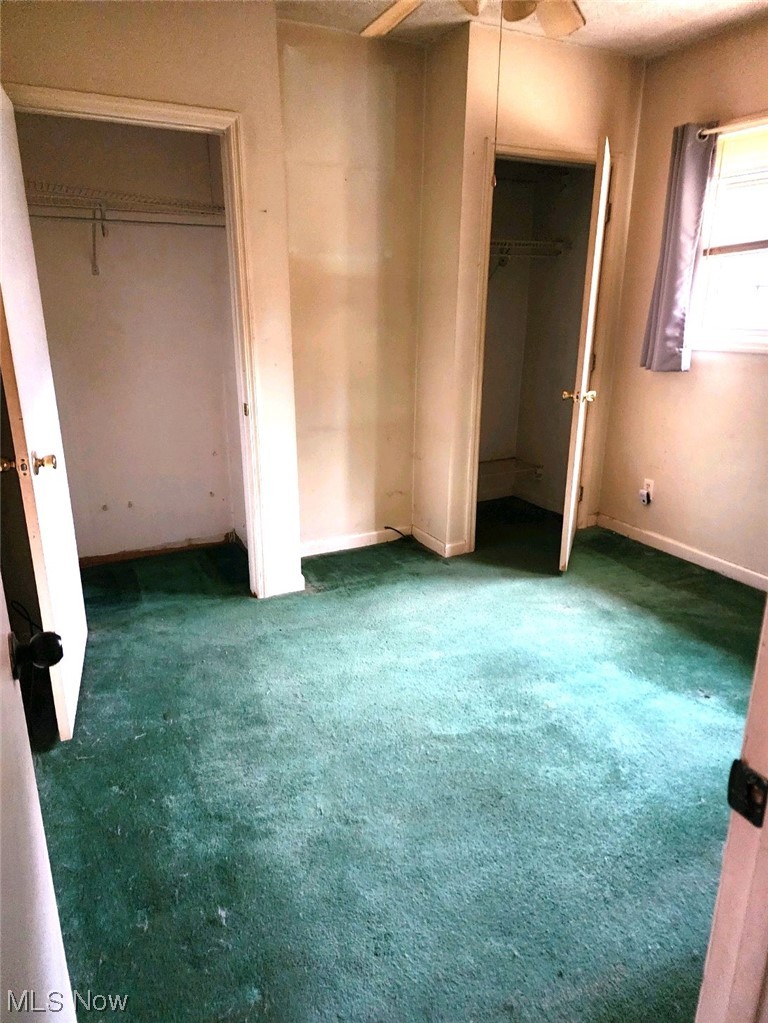 772 Peters Run Road Wheeling, WV 26003 - Photo 6 of 8 Unfurnished bedroom featuring dark colored carpet and ceiling fan