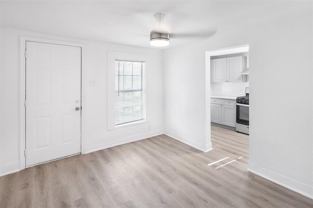 1911 Benson Street, Unit 2 Houston, TX 77020 - Photo 3 of 12 wooden floor in an empty room with a window