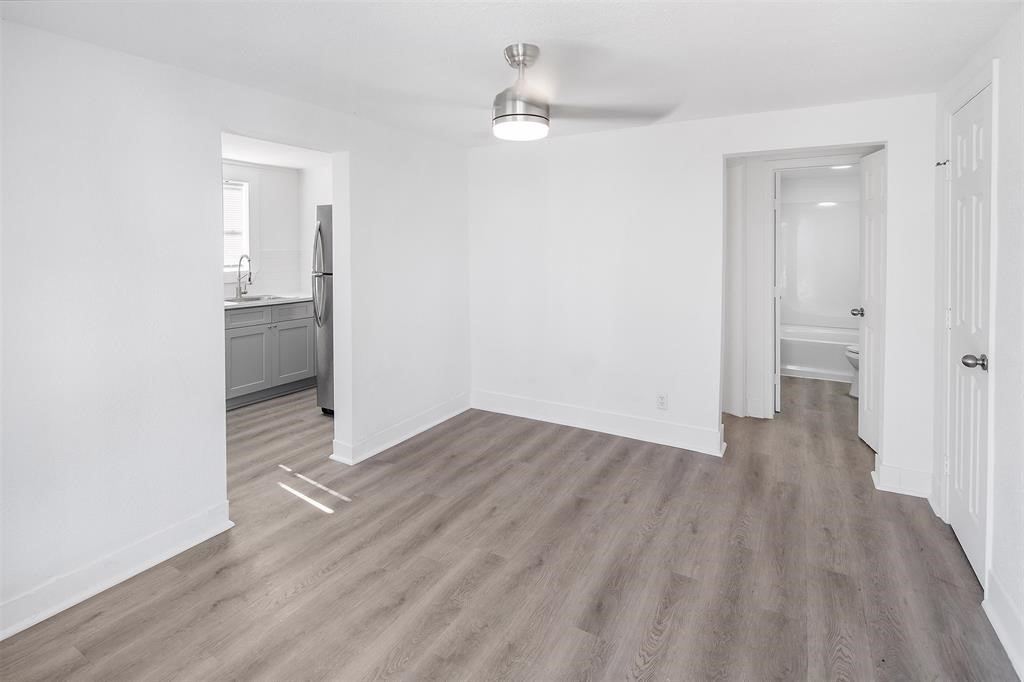 1911 Benson Street, Unit 2 Houston, TX 77020 - Photo 5 of 12 wooden floor in an empty room with a bathroom