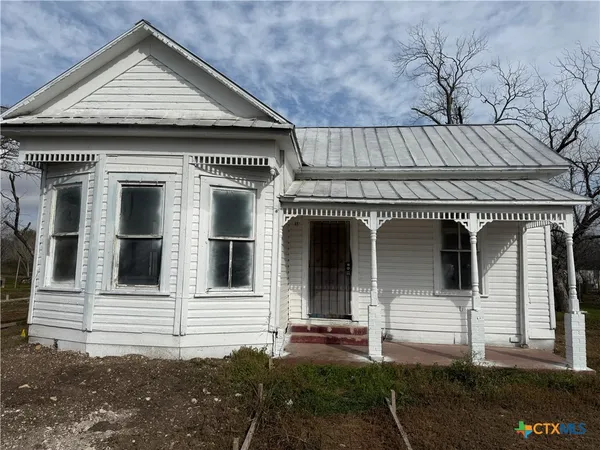 a front view of a house with garage
