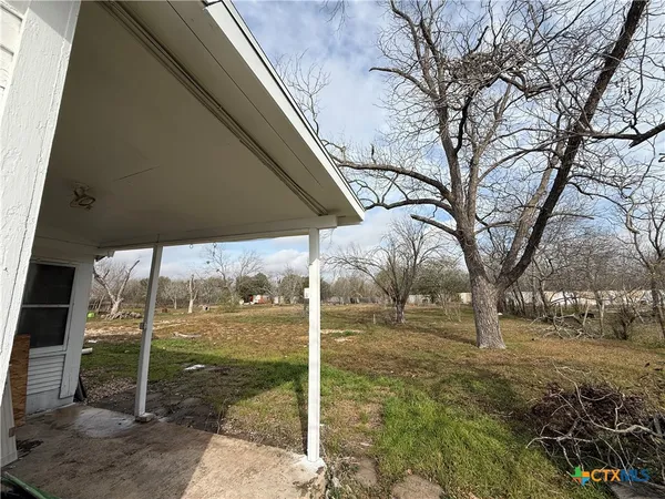 a view of a field with an ocean