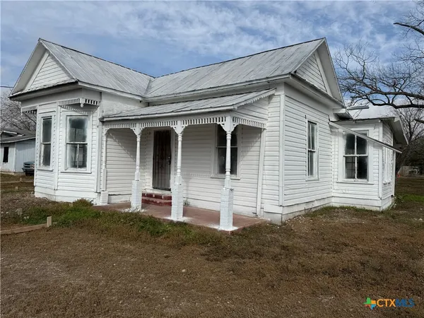 a front view of a house with garage