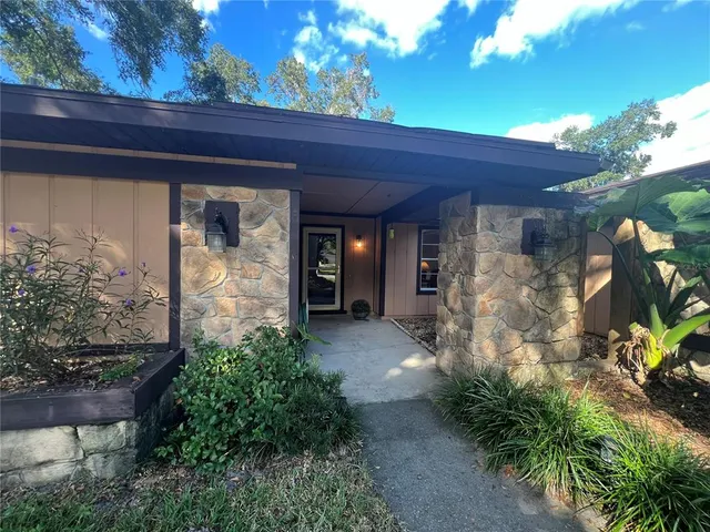 a entryway view with a garden