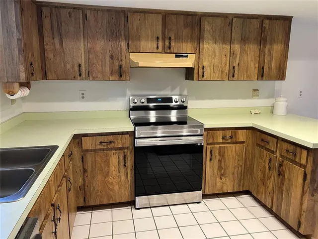 a kitchen with a stove and a cabinets