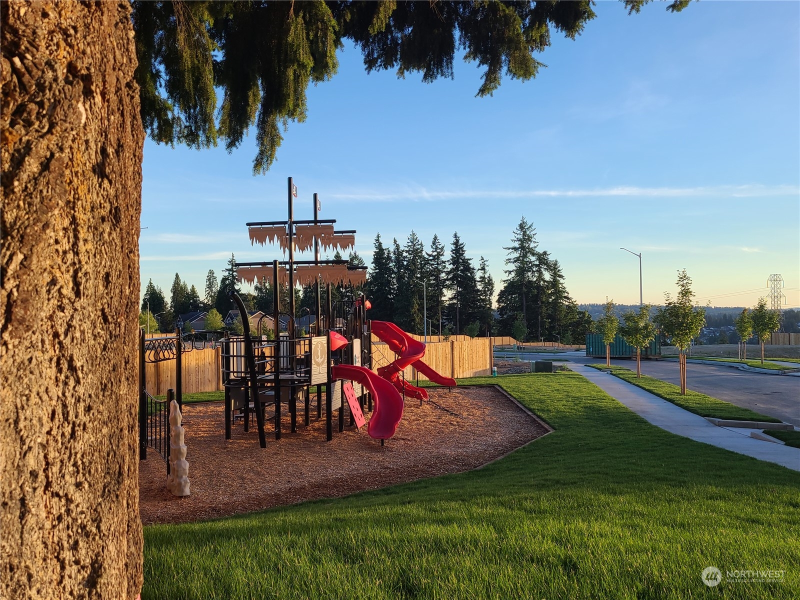 4417 242nd Place Southeast Bothell, WA 98021 - Photo 4 of 8 an aerial view of a house with swimming pool garden and lake view