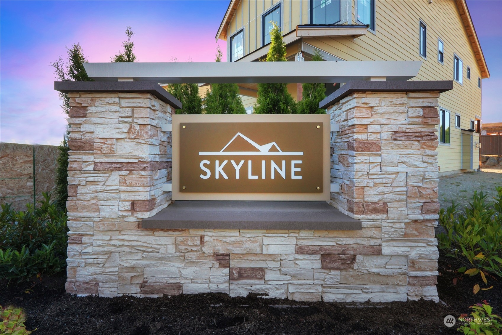 4417 242nd Place Southeast Bothell, WA 98021 - Photo 5 of 8 a sign broad on the side of a brick building